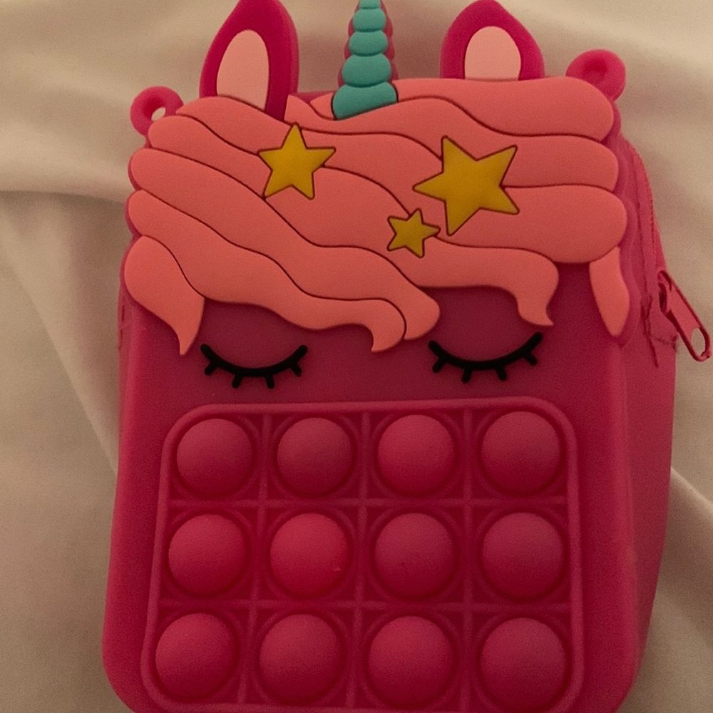 I’m selling a pink poppet bag it’s fun to wear and keeps you entertained
